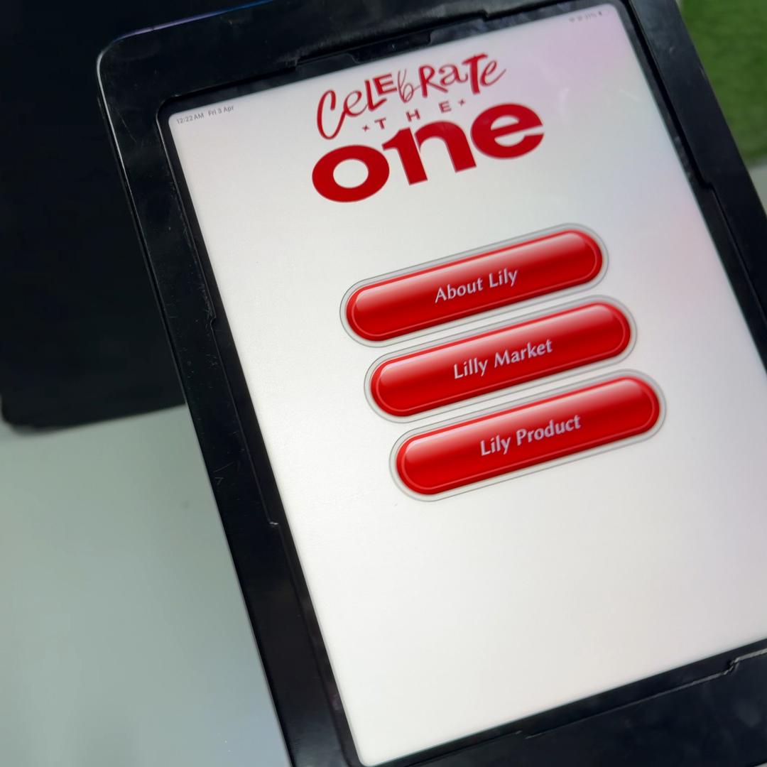 AI kiosk at an event features a digital display of a ai hologram woman in a blue hijab